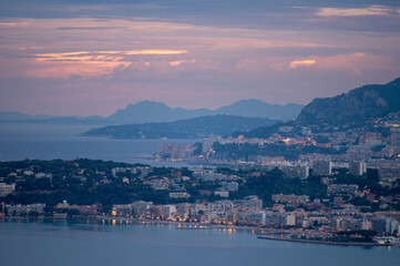 Fototapeta premium Night view on French Riviera, colorful Menton old city and marina on blue Mediterranean Sea near French-Italian border, Monaco, Monte-Carlo, travel destination, panoramic view