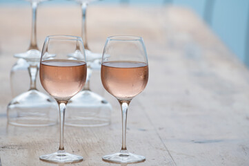 Summer time in Provence, two glasses of cold rose wine with blue sea view on background, French Riviera near Menton, south of France