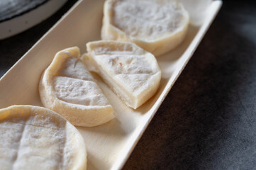 Rocamadour or cabecous soft goat AOC cheese with soft rind produced on farm in Perigord and Quercy on farmers market, departement Lot, France