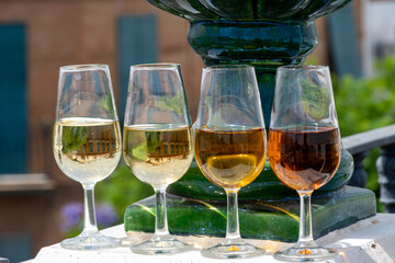 Sherry wine tasting on roof of old Triana district in Sevilla with view on Sevilla houses and churches, wine glasses