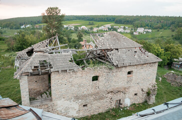 Enigmatic Ruins of a Once Majestic Structure Surrounded by Lush Greenery