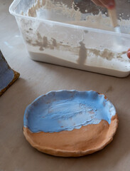Samples of ceramic art objects and tabelware during workshop in art ceramic atelier in Poland