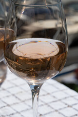 Glasses of cold rose gris Cote de Provence wine in yacht harbour of Port Grimaud, summer vacation on French Riviera in Provence, France