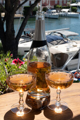 Summer party, French brut rose champagne sparkling wine in coupe glasses in yacht harbour of Port Grimaud near Saint-Tropez, French Riviera vacation, Var, France