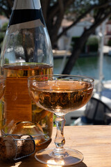 Summer party, French brut rose champagne sparkling wine in coupe glasses in yacht harbour of Port Grimaud near Saint-Tropez, French Riviera vacation, Var, France