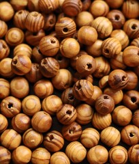 Brown wooden beads, closeup background photo.