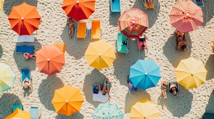 Colorful beach umbrellas shade sunbathers on a sandy shore in a vibrant coastal setting during a sunny summer day