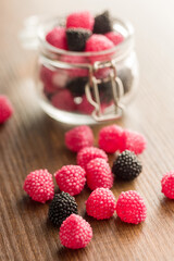 Sweet jelly candies on wooden table.