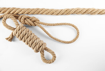Hemp ropes on white background, top view