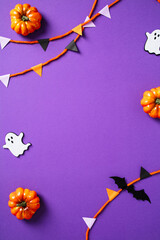 Happy Halloween poster template. Top view Halloween bunting garland, pumpkins, spiders, ghosts,...