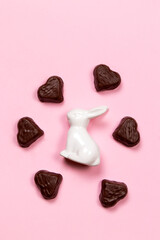 White ceramic Easter bunny figurine and heart-shaped chocolate candy