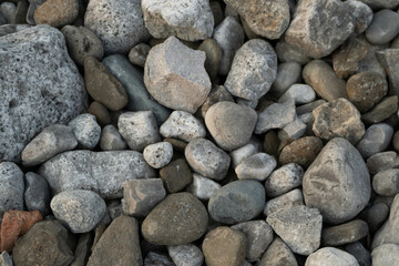 Processed collage of sea shore pebbles texture. Background for banner, backdrop or texture for 3D mapping