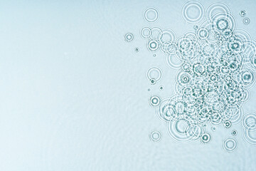 Gentle ripples form on a serene blue surface