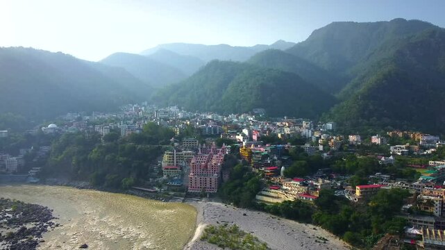 Rishikesh, uttrakhand, India 22 june 2022. Aerial view of the beautiful holy river ganga, lakshman Jhula bridge, and tera manzil temple, trimbakeshwar in rishikesh.