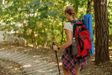 A dedicated hiker is actively exploring stunning nature trails with a backpack and gear