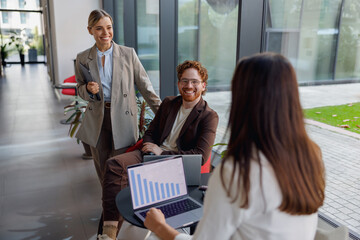 A highly professional team collaborates effectively within a modern office setting, utilizing valuable data insights