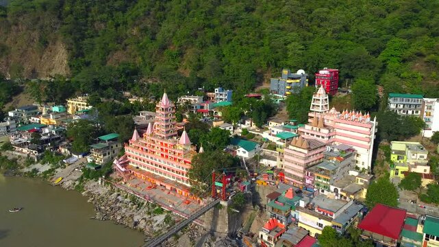 Rishikesh, uttrakhand, India 22 june 2022. Aerial view of the beautiful holy river ganga, lakshman Jhula bridge, and tera manzil temple, trimbakeshwar in rishikesh.