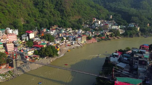Rishikesh, uttrakhand, India 22 june 2022. Aerial view of the beautiful holy river ganga, lakshman Jhula bridge, and tera manzil temple, trimbakeshwar in rishikesh.