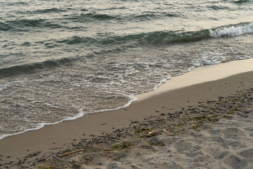 beautiful sand beach during sunset with wave