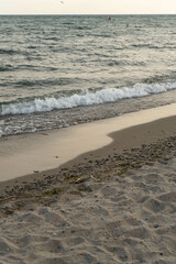 beautiful sand beach during sunset with wave