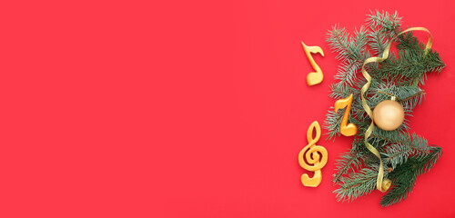 Notes, violin clef and Christmas decor on color background © Pixel-Shot