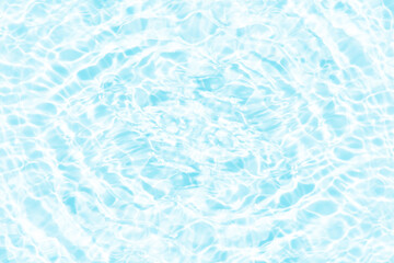 Fototapeta premium Blue water with ripples on the surface. Defocus blurred transparent blue colored clear calm water surface texture with splashes and bubbles. Water waves with shining pattern texture background.