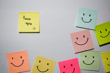 Thank you and smile emoticon on sticky notes. Motivational for personal development, inspirational...