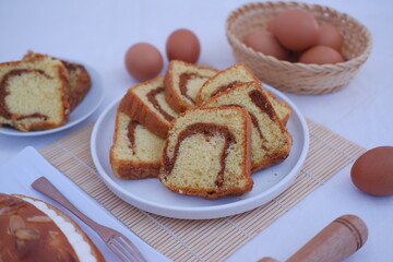 sponge cake on a white plate with beautiful decoration