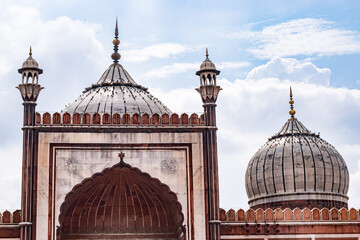 Architectural detail of the ornate domes and minarets of the jama masjid mosque in delhi, india