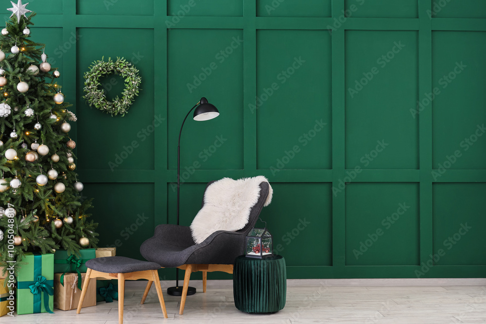 Wall mural Interior of living room with grey armchair and gift boxes under Christmas tree