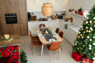 Blurred view of festive kitchen with Christmas decorations