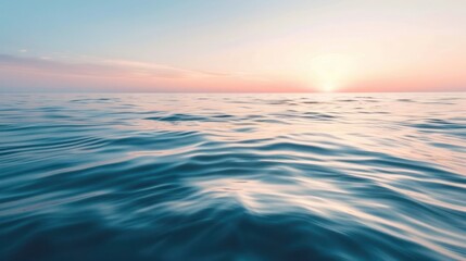 Obraz premium A calm ocean at sunrise, with the first light of day reflecting on the water and a peaceful, quiet atmosphere