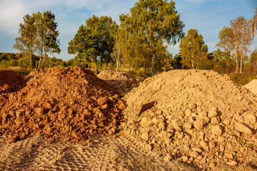 Mounds of soil brought in to level the area