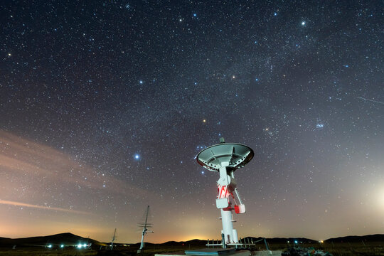 radio telescope on the background of stellar tracks, The observatory's radio telescope