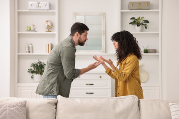 Emotional couple arguing at home. Relationship problems