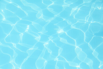 Clear water in outdoor swimming pool on sunny day