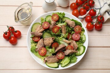 Delicious fresh tuna salad on white wooden table, flat lay