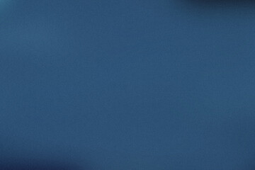 A plain blue wall noisy color, potentially used for a photo shoot or other creative endeavors