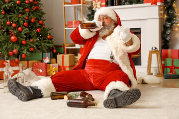 Drunk Santa Claus with beer showing middle finger at Christmas party