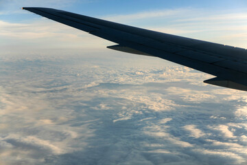 airplane wing and cloud during the flight