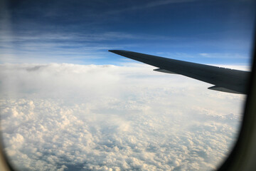 airplane wing and cloud during the flight