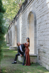 An artistic photoshoot showcasing a diverse couples love story in a beautiful setting, highlighting their unique bond and deep emotional connection, and celebrating the joy of their relationship