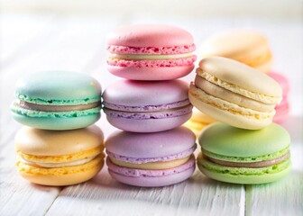 Obraz premium Delicate French macarons in soft pastel hues sit atop a pristine white background, showcasing their delicate shells and vibrant filling colors in sharp focus.