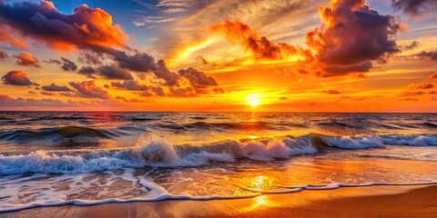 Obraz premium Vibrant orange and pink hues bleed across the horizon as the sun dips below the waves, casting a warm golden glow on the tranquil ocean scene.