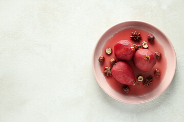 Tasty and delicious food concept - pear in wine