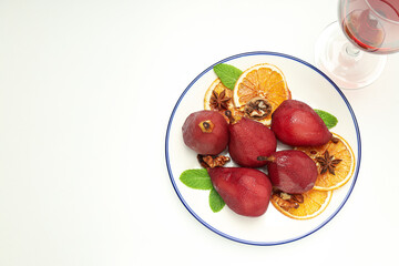 Tasty and delicious food concept - pear in wine