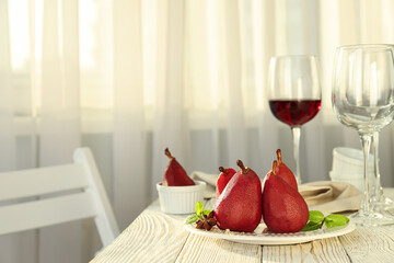Tasty and delicious food concept - pear in wine
