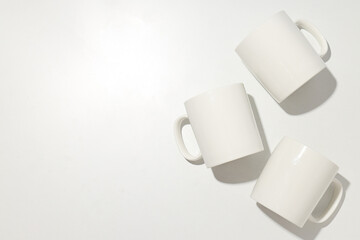 White glass cups on a light background