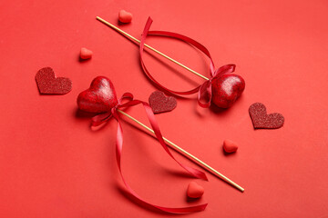 Composition with different hearts for Valentine's Day on red background