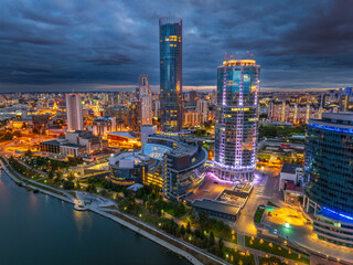 Yekaterinburg city and pond aerial panoramic view at summer or early autumn night. Night city in the early autumn or summer.